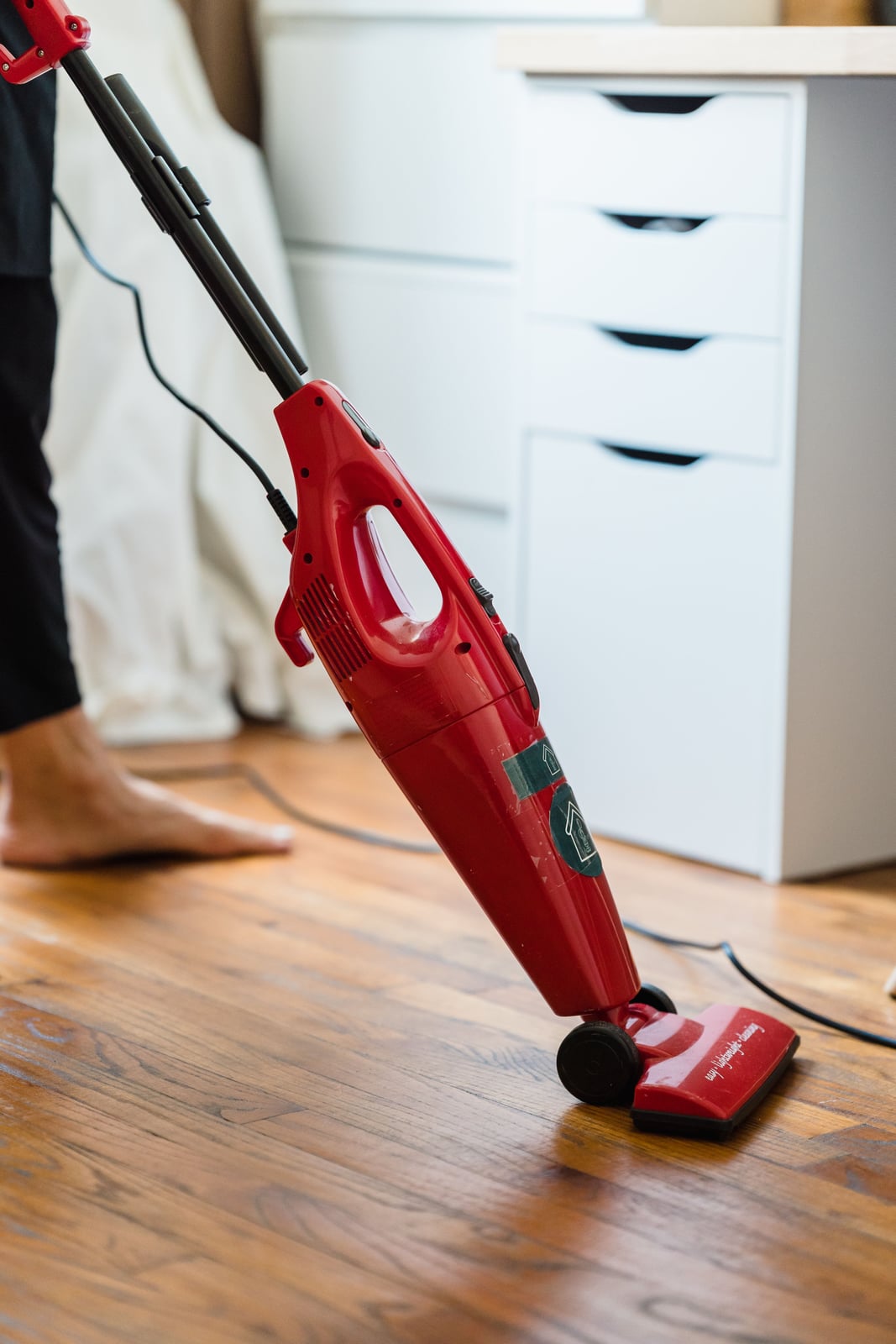 A compact upright vacuum illustrating smaller-area floor care